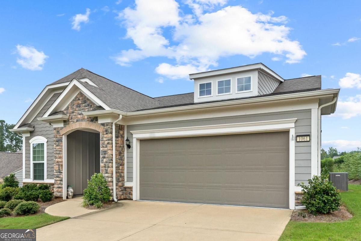 1061 Little Shls Road Greensboro, GA 30642 - Photo 2 of 41 a front view of a house with garden