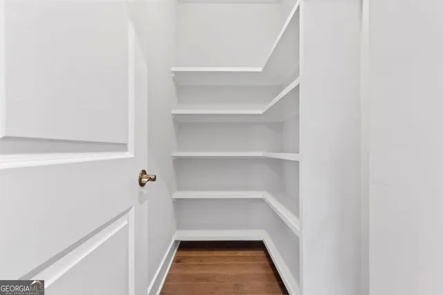 a hallway view with wooden floor