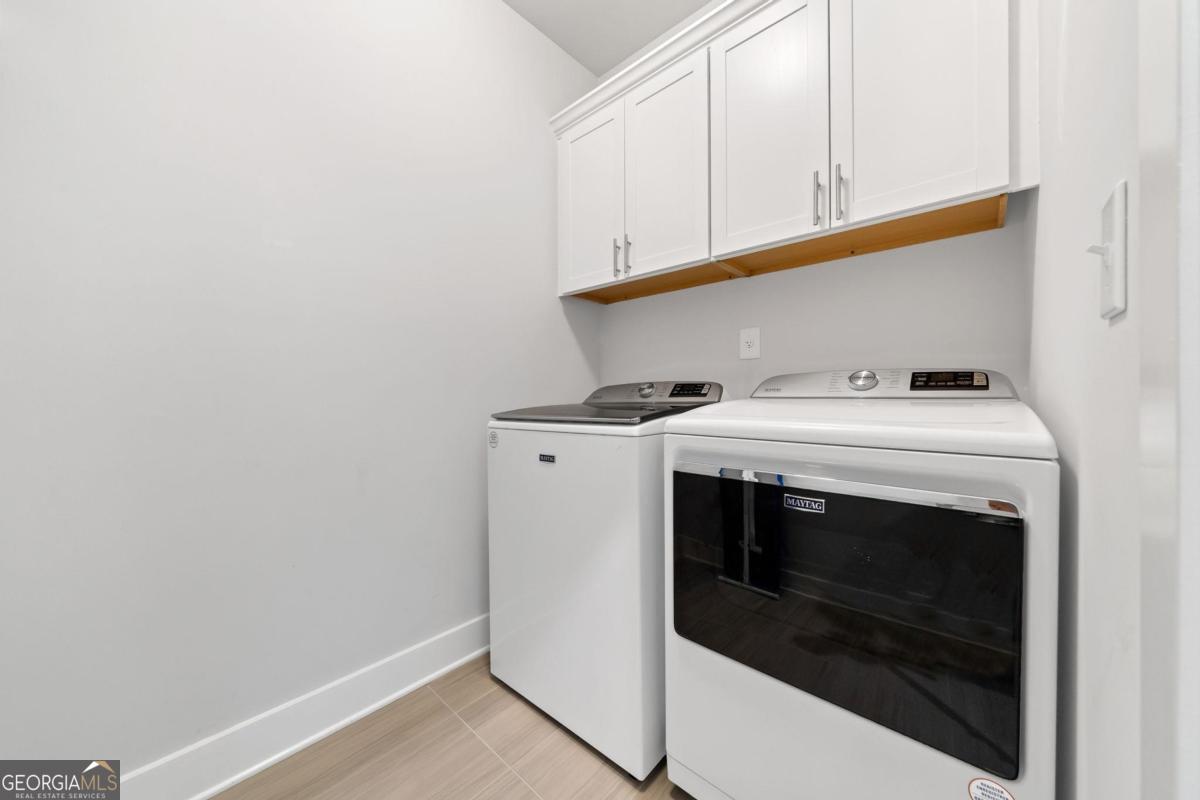 1061 Little Shls Road Greensboro, GA 30642 - Photo 35 of 41 a utility room with dryer and washer