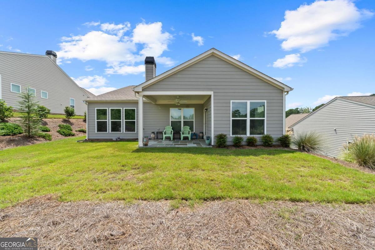 1061 Little Shls Road Greensboro, GA 30642 - Photo 40 of 41 a view of a house with backyard and sitting area