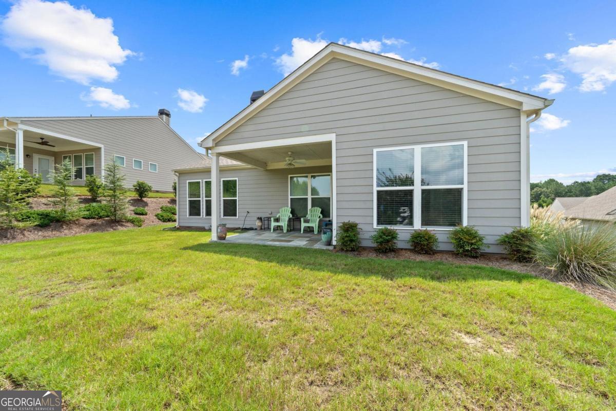 1061 Little Shls Road Greensboro, GA 30642 - Photo 41 of 41 a front view of house with yard and outdoor seating