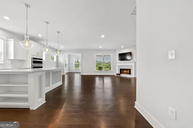 a view of a kitchen with furniture and a ceiling fan