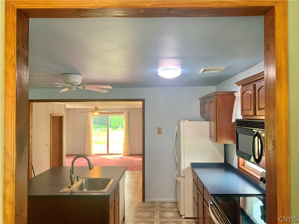 53 Pinecrest Road Whitestown, NY 13492 - Photo 9 of 33 Pass-through view from dining room into kitchen