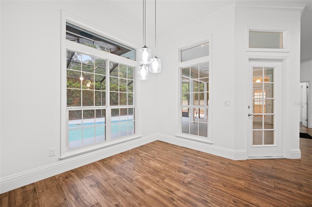 9702 Southwest 35th Lane Gainesville, FL 32608 - Photo 17 of 46 an empty room with wooden floor and windows