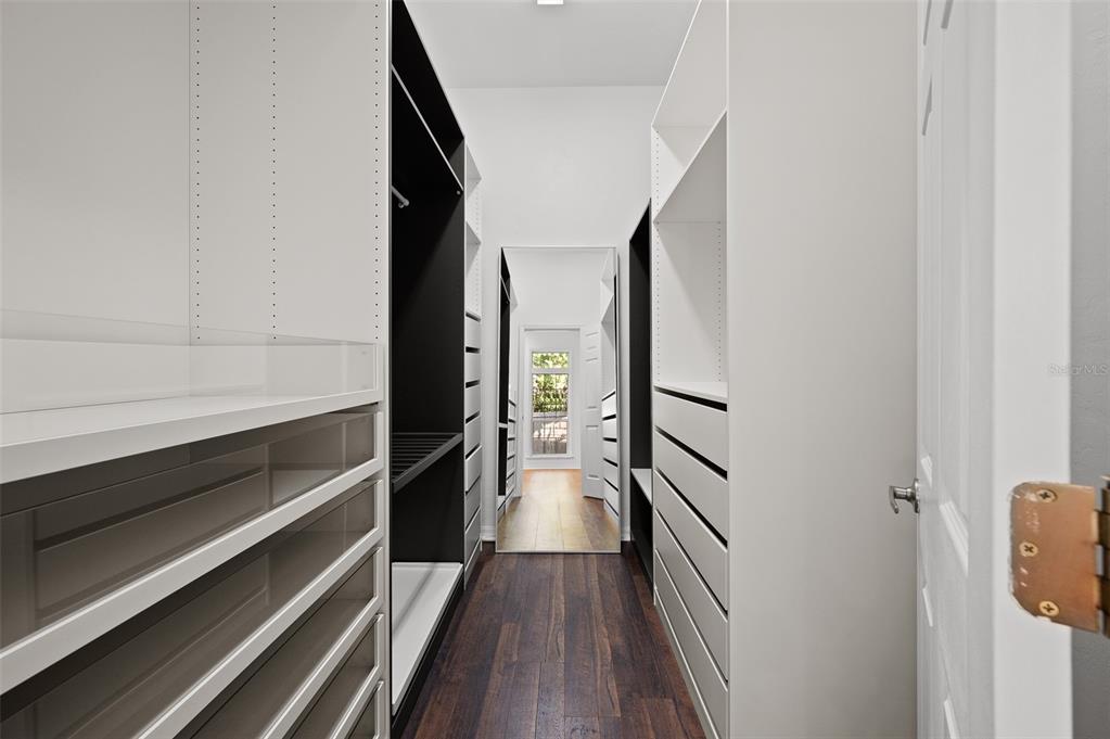 9702 Southwest 35th Lane Gainesville, FL 32608 - Photo 22 of 46 a view of a hallway with wooden floor and staircase