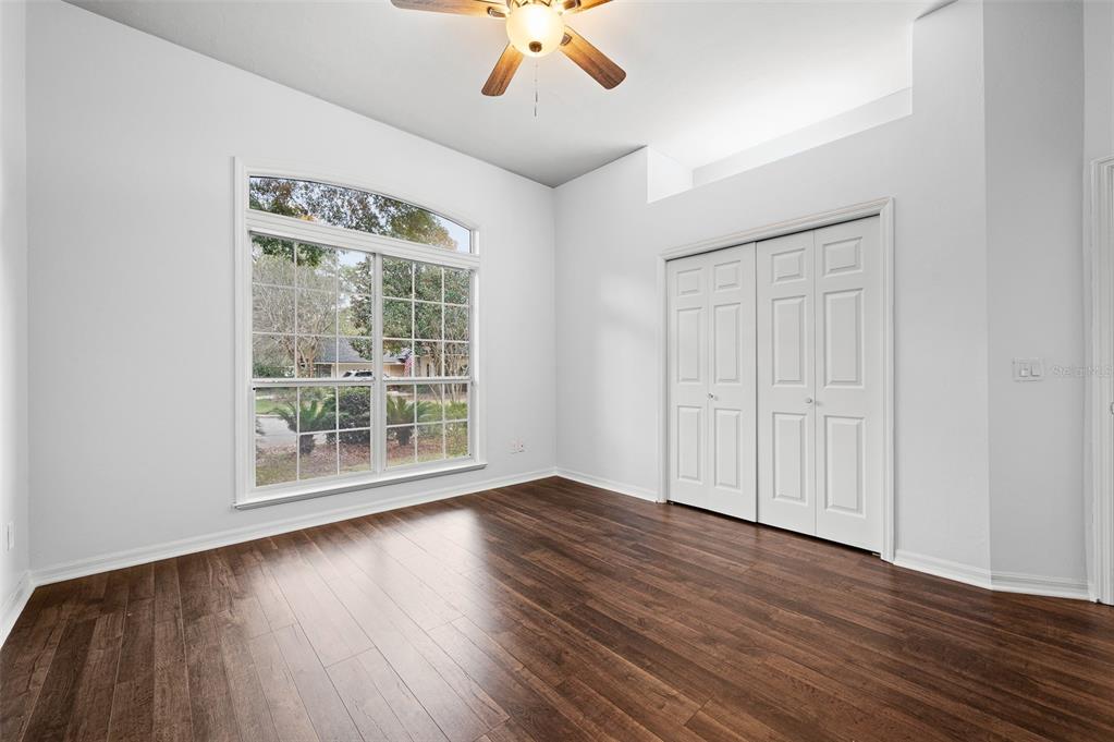 9702 Southwest 35th Lane Gainesville, FL 32608 - Photo 29 of 46 wooden floor in an empty room with a window