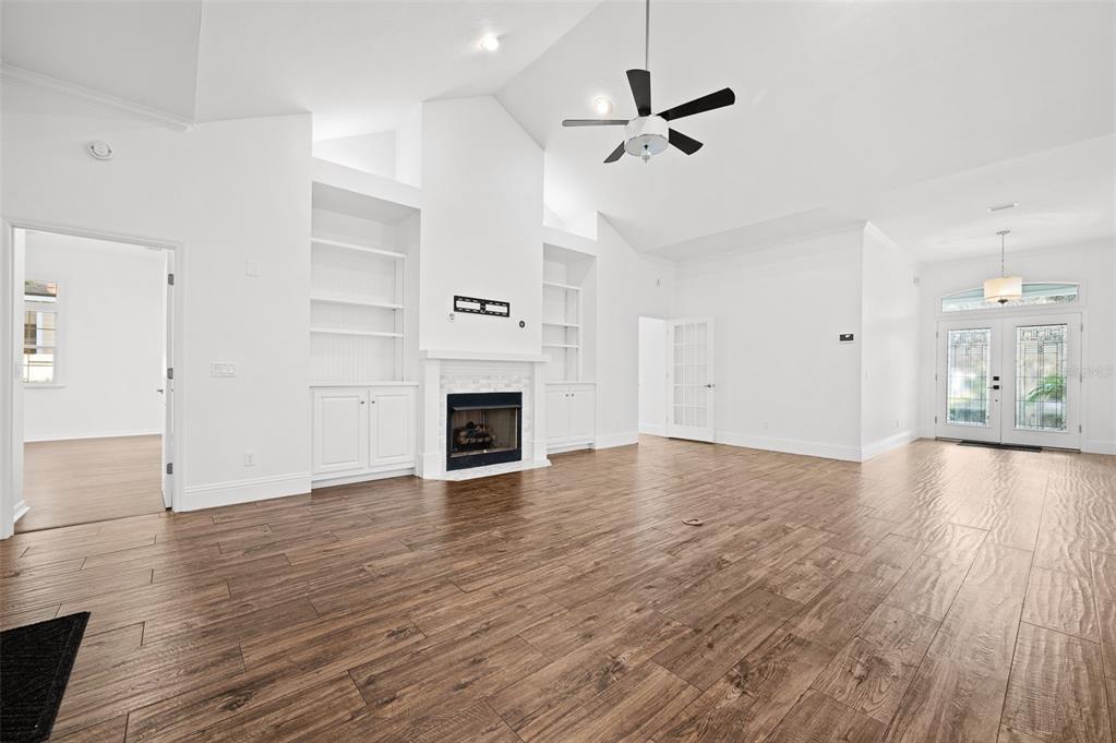 9702 Southwest 35th Lane Gainesville, FL 32608 - Photo 4 of 46 a view of empty room with wooden floor and window