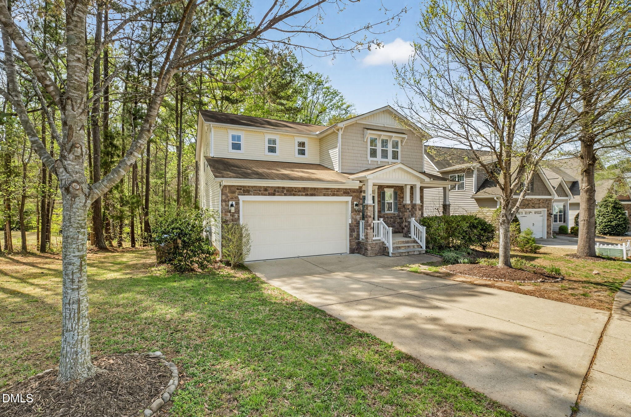 1304 Barnford Mill Road Wake Forest, NC 27587 - Photo 2 of 44 a front view of a house with a yard garage and outdoor seating