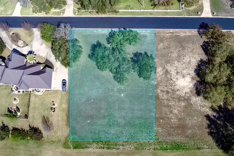 an aerial view of residential house with outdoor space