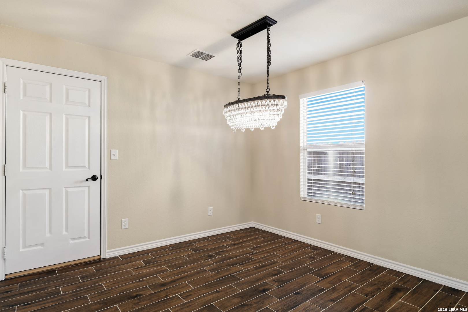 11839 Dove Ranch San Antonio, TX 78254 - Photo 14 of 35 a view of empty room with wooden floor and fan