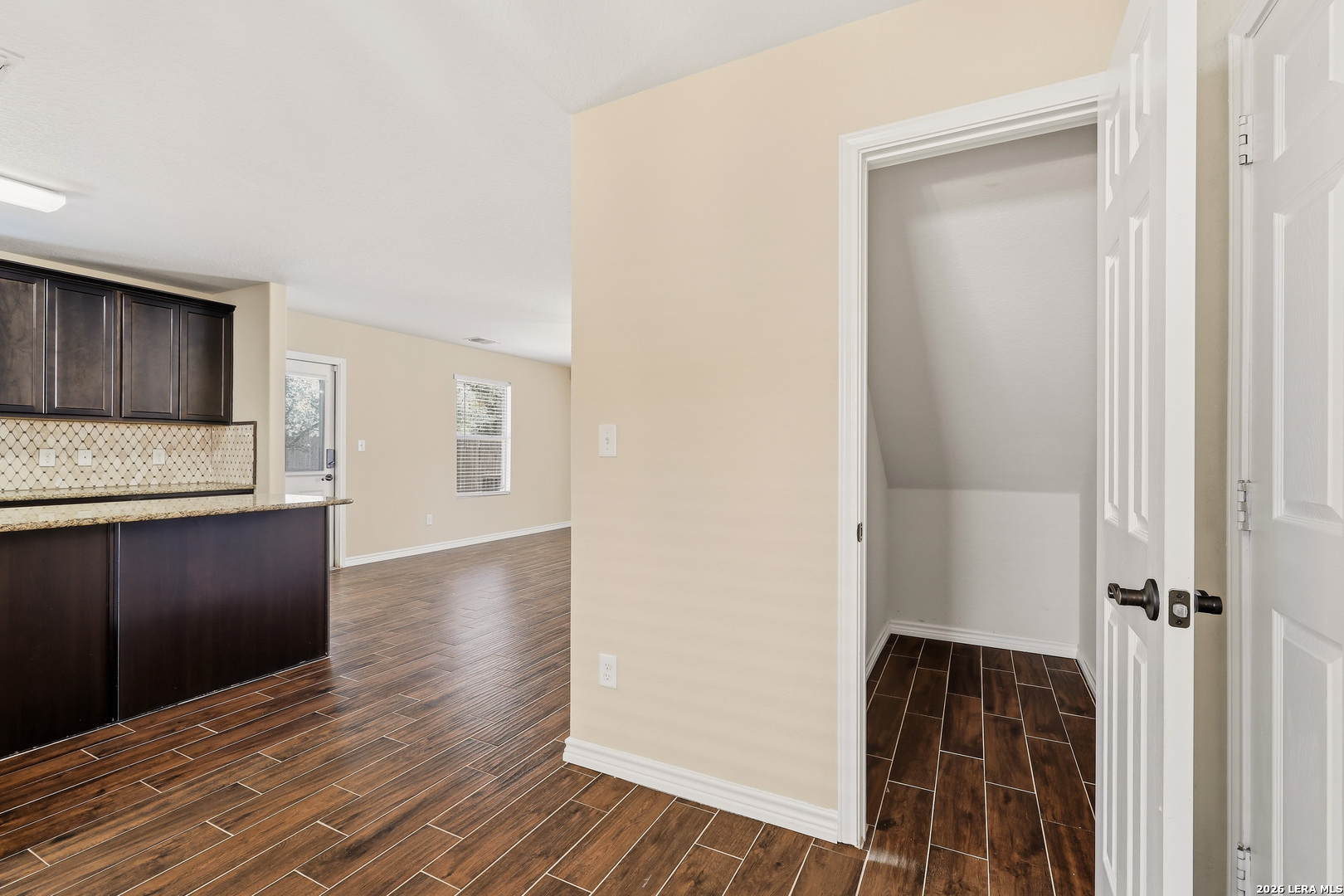 11839 Dove Ranch San Antonio, TX 78254 - Photo 15 of 35 a view of a kitchen cabinets wooden floor and a window