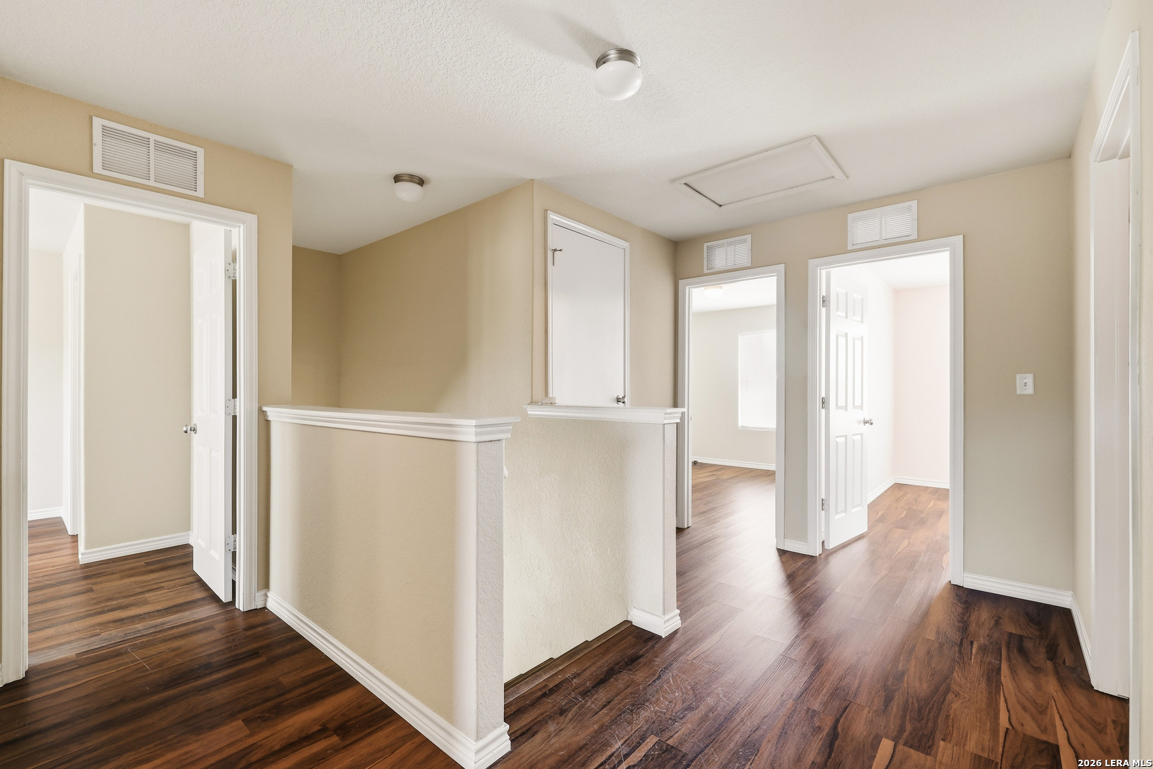 11839 Dove Ranch San Antonio, TX 78254 - Photo 17 of 35 a view of a hallway with wooden floor and closet
