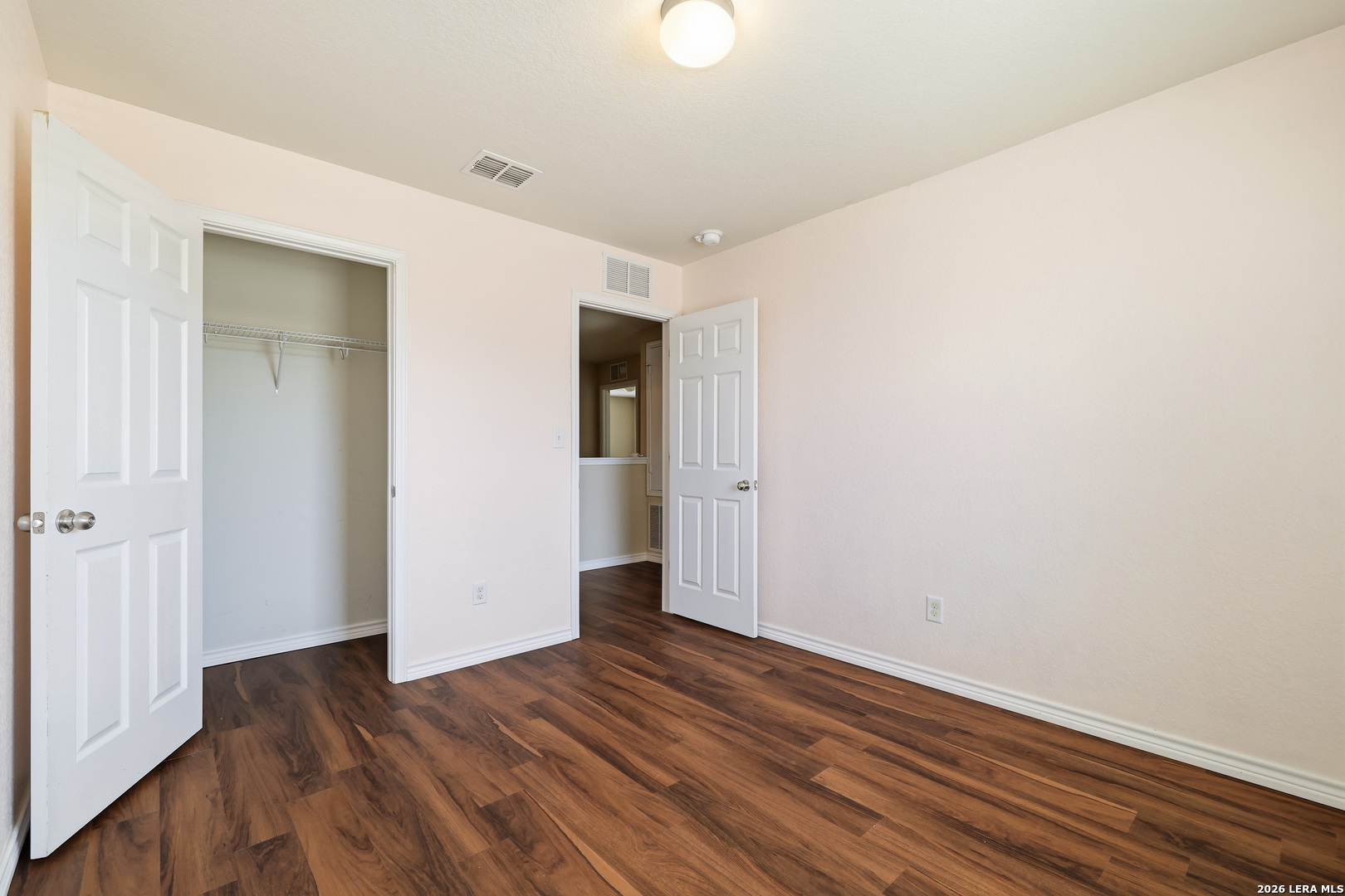 11839 Dove Ranch San Antonio, TX 78254 - Photo 27 of 35 a view of an empty room with wooden floor