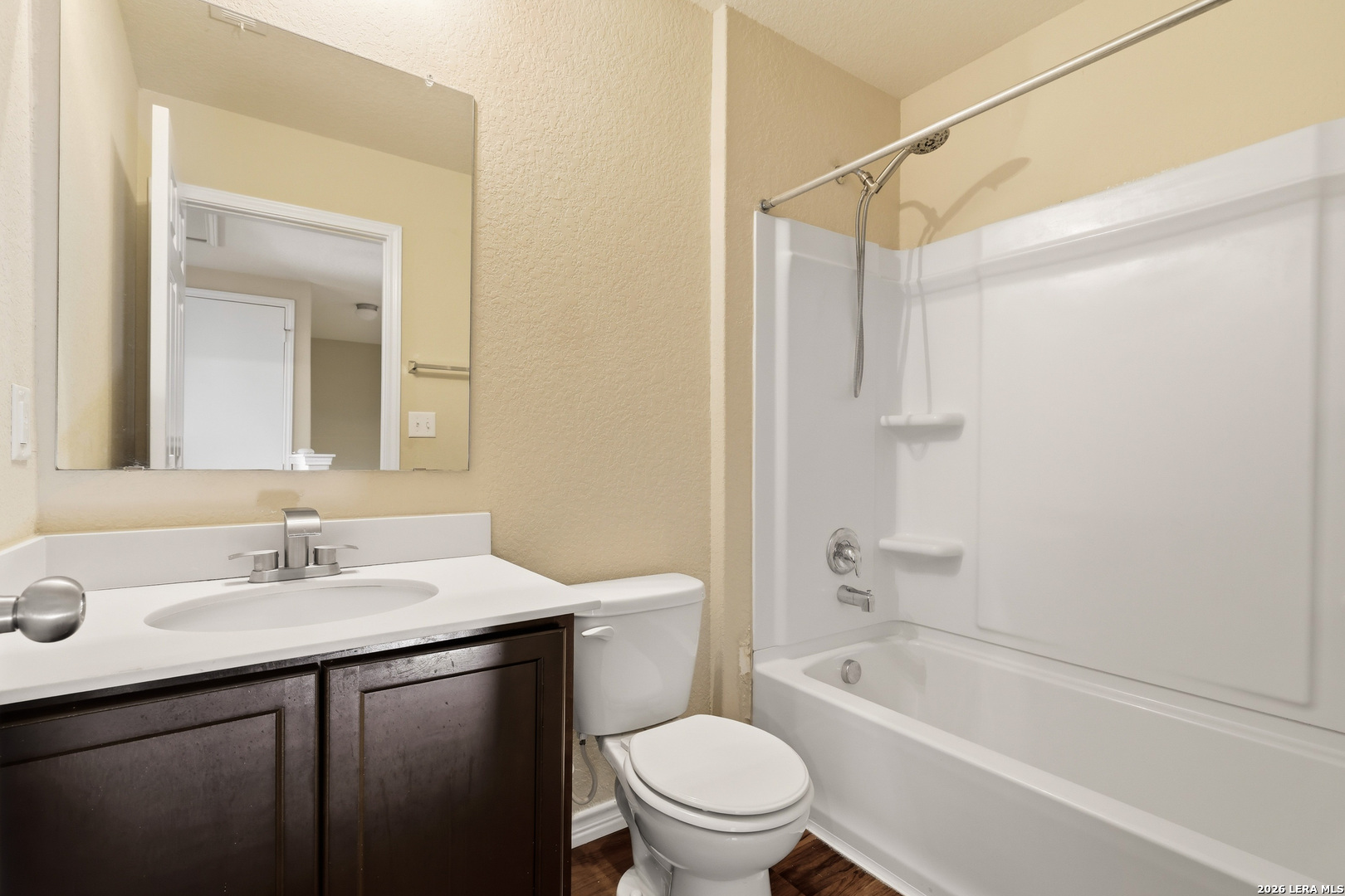 11839 Dove Ranch San Antonio, TX 78254 - Photo 28 of 35 a bathroom with a sink a toilet and shower