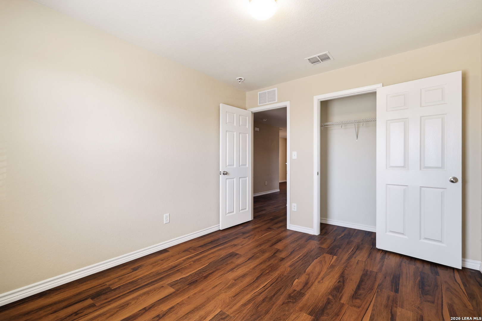 11839 Dove Ranch San Antonio, TX 78254 - Photo 30 of 35 a view of an empty room with wooden floor