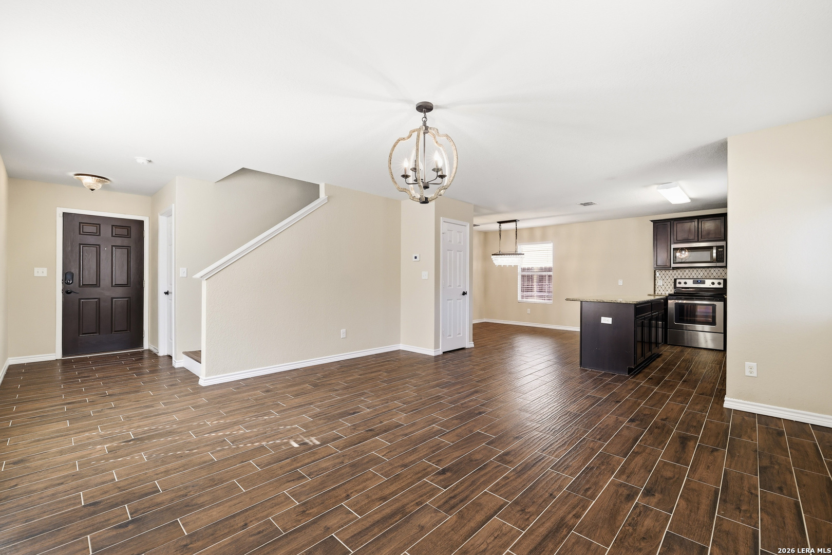11839 Dove Ranch San Antonio, TX 78254 - Photo 6 of 35 a view of empty room with wooden floor