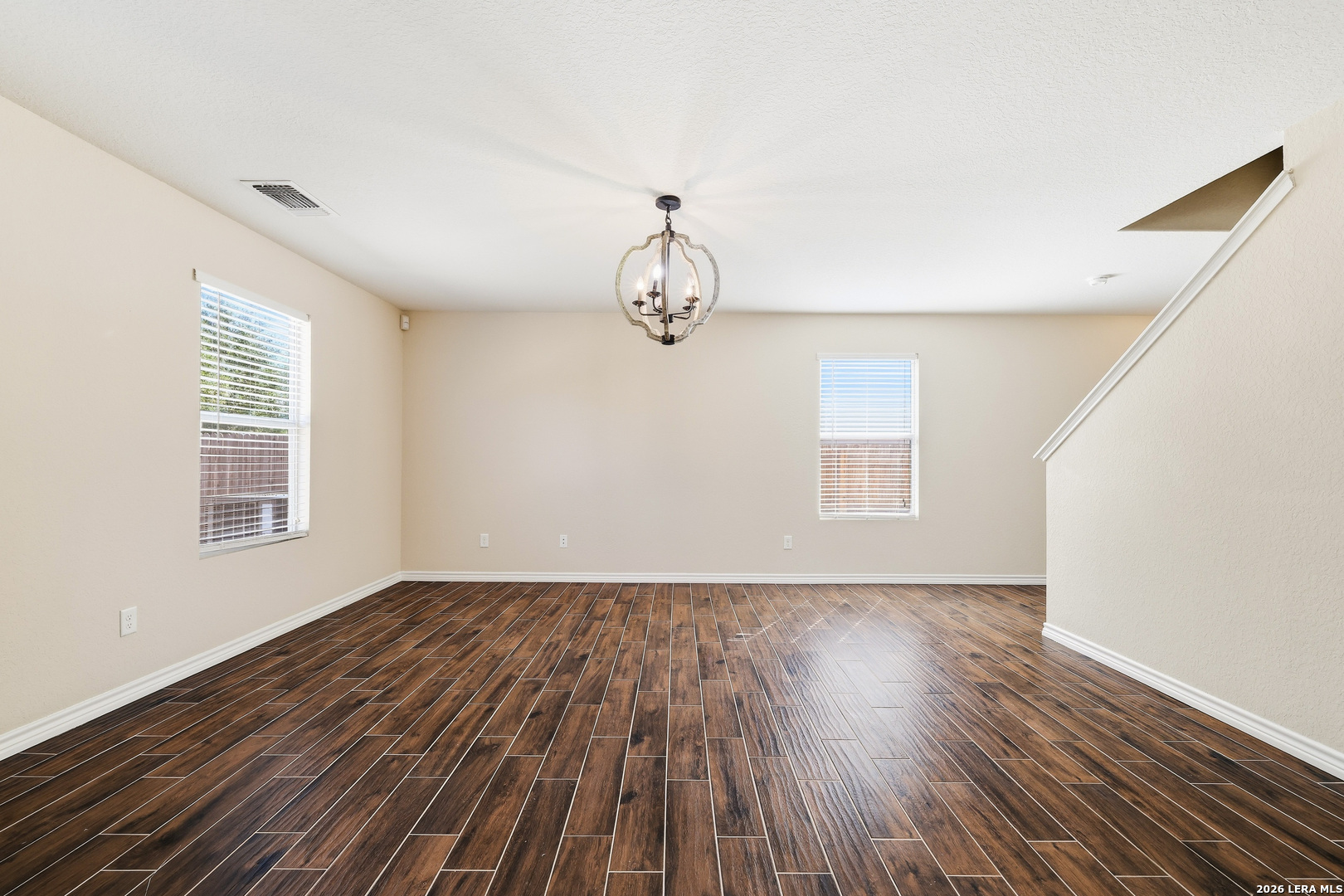 11839 Dove Ranch San Antonio, TX 78254 - Photo 8 of 35 a view of empty room with wooden floor and fan