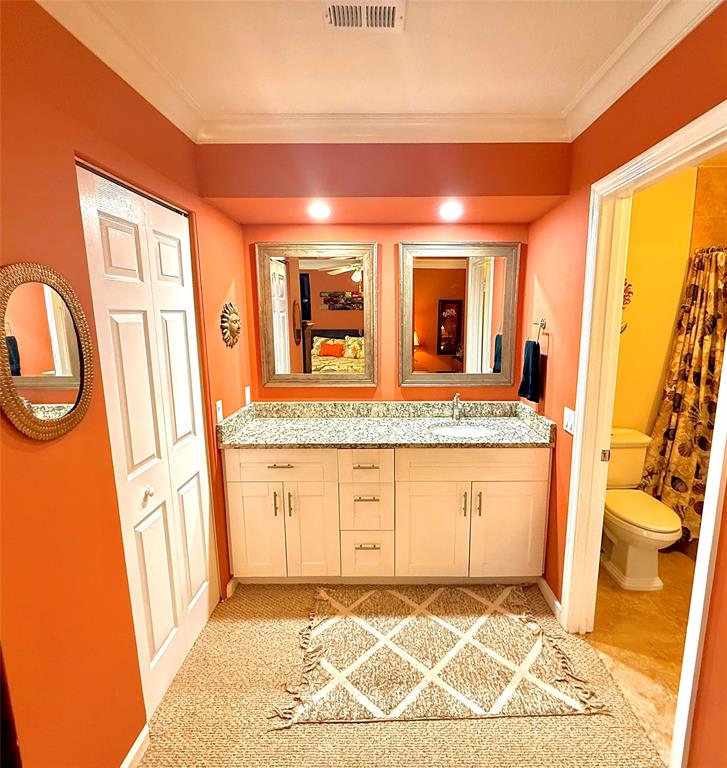 3117 Kingswood Terrace, Unit 3117 Boca Raton, FL 33431 - Photo 2 of 15 a view of a bathroom with a sink and a mirror
