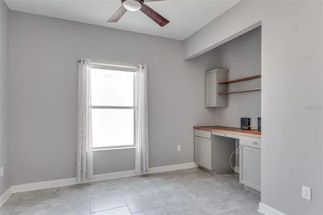 a view of cabinets and window in a room