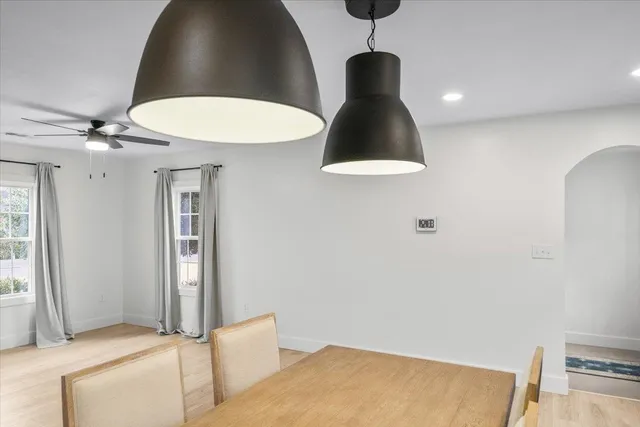 a view of a kitchen with tub and window