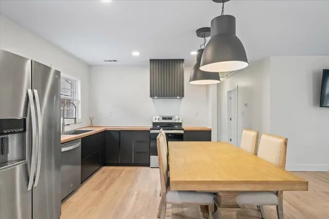a kitchen with a sink and a stove