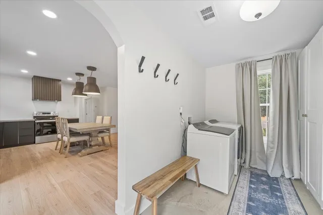 a view of an entryway with wooden floor
