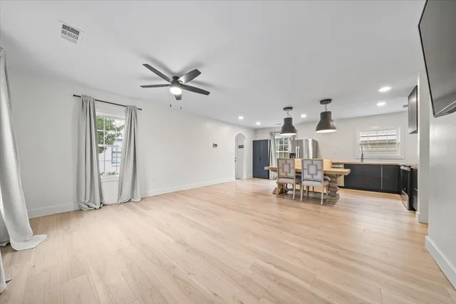 a view of dining room with furniture and wooden floor