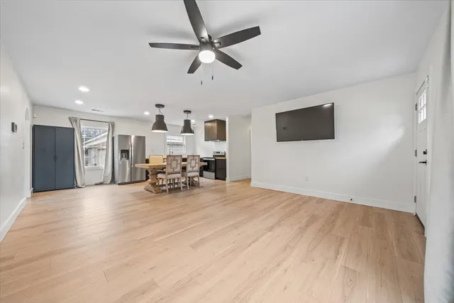 a view of a livingroom with furniture and a flat screen tv