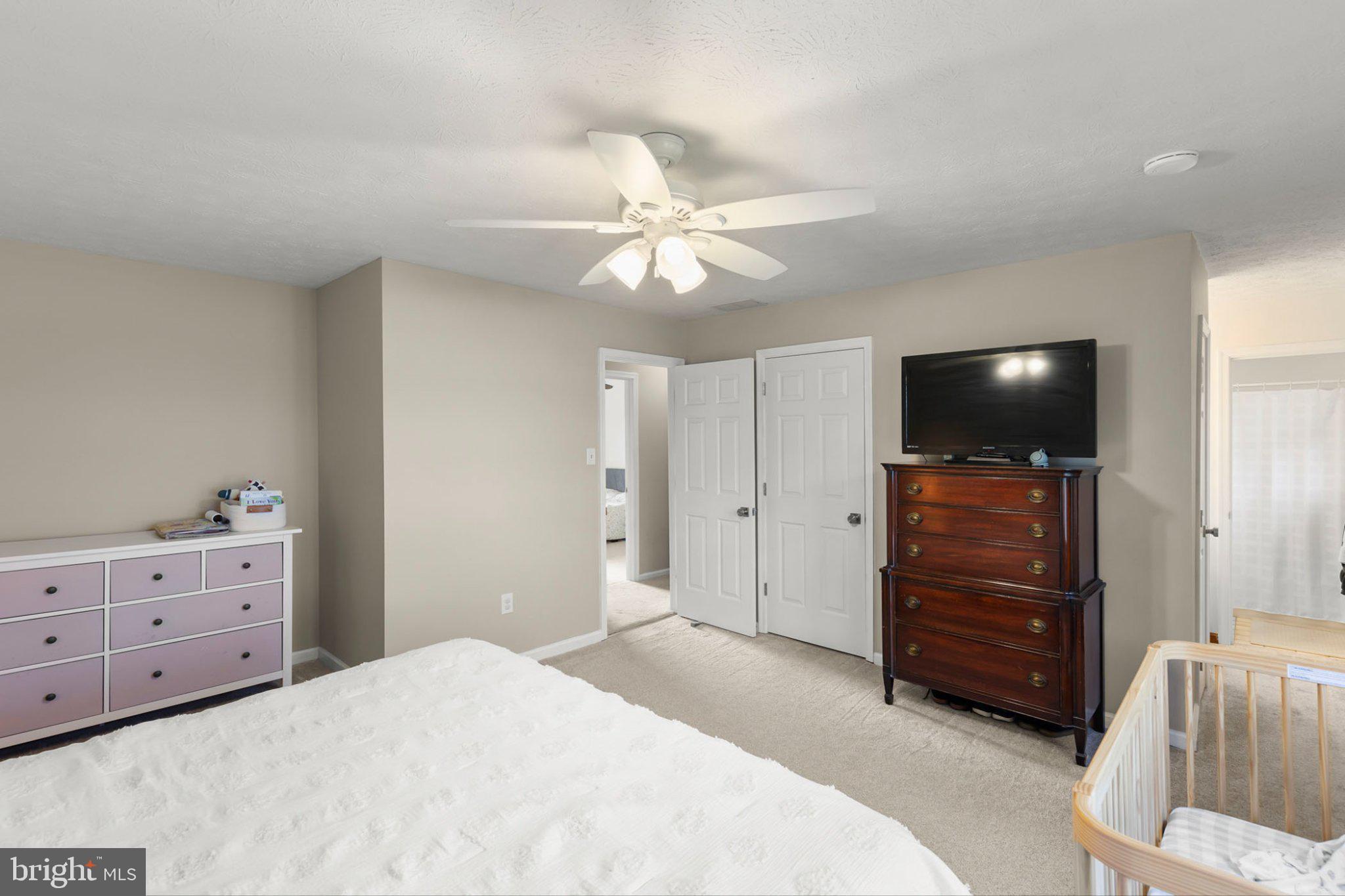 111 Asbury Road Winchester, VA 22602 - Photo 18 of 39 Serene bedroom with modern charm.
