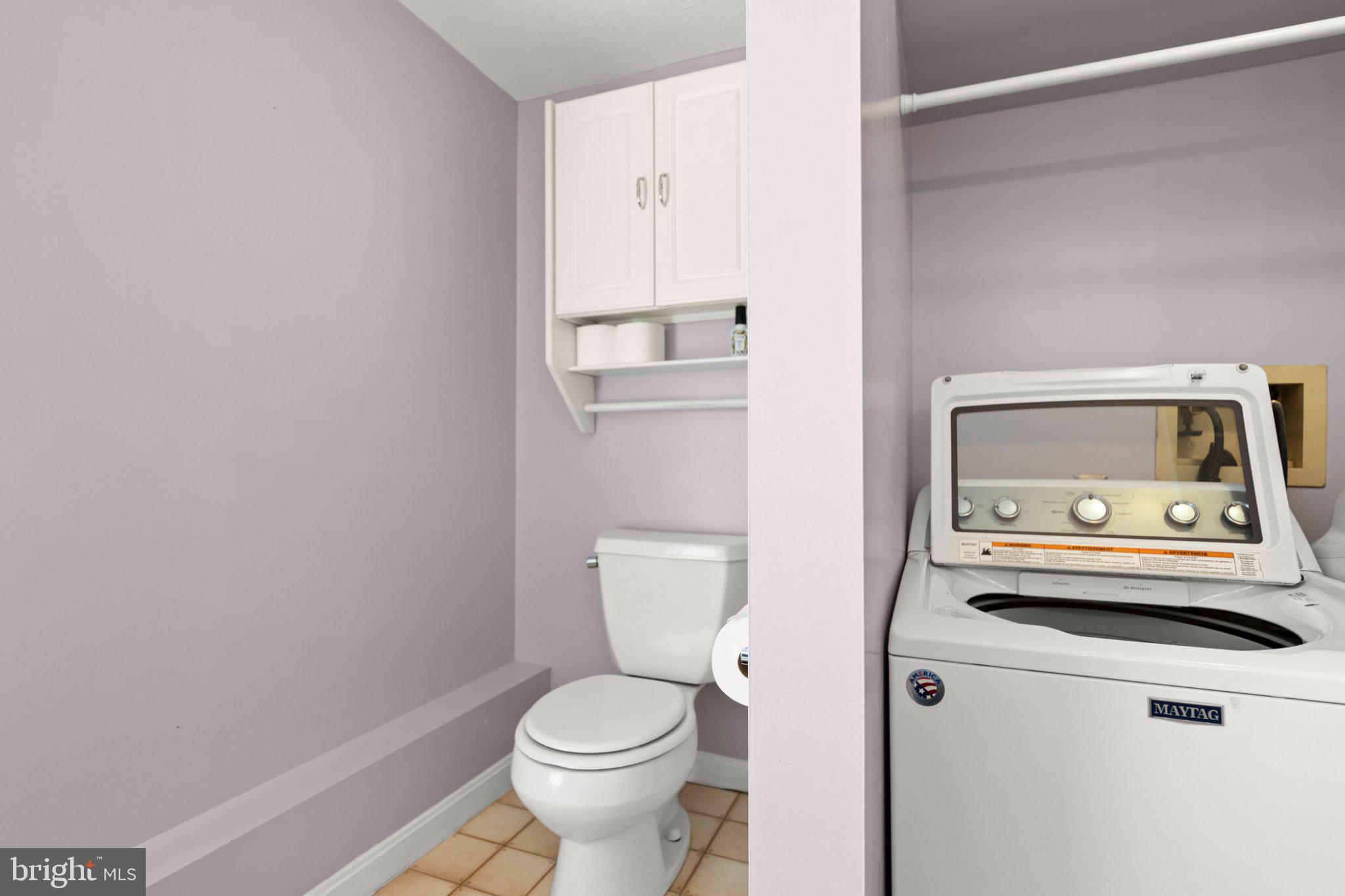 111 Asbury Road Winchester, VA 22602 - Photo 32 of 39 Charming laundry nook with pastel hues.
