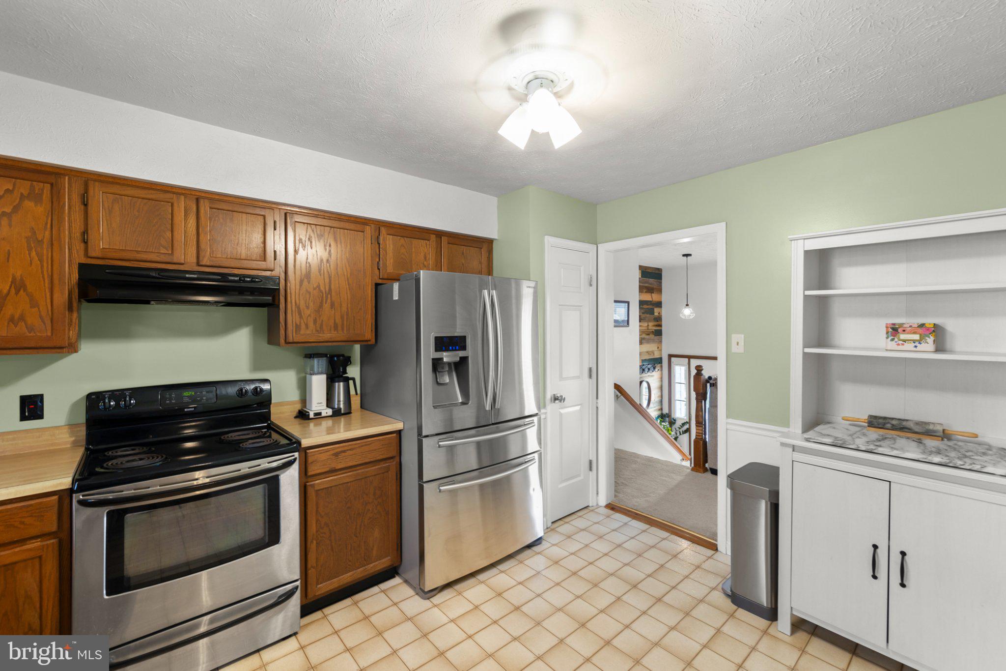 111 Asbury Road Winchester, VA 22602 - Photo 4 of 39 Modern kitchen with warm wood accents.