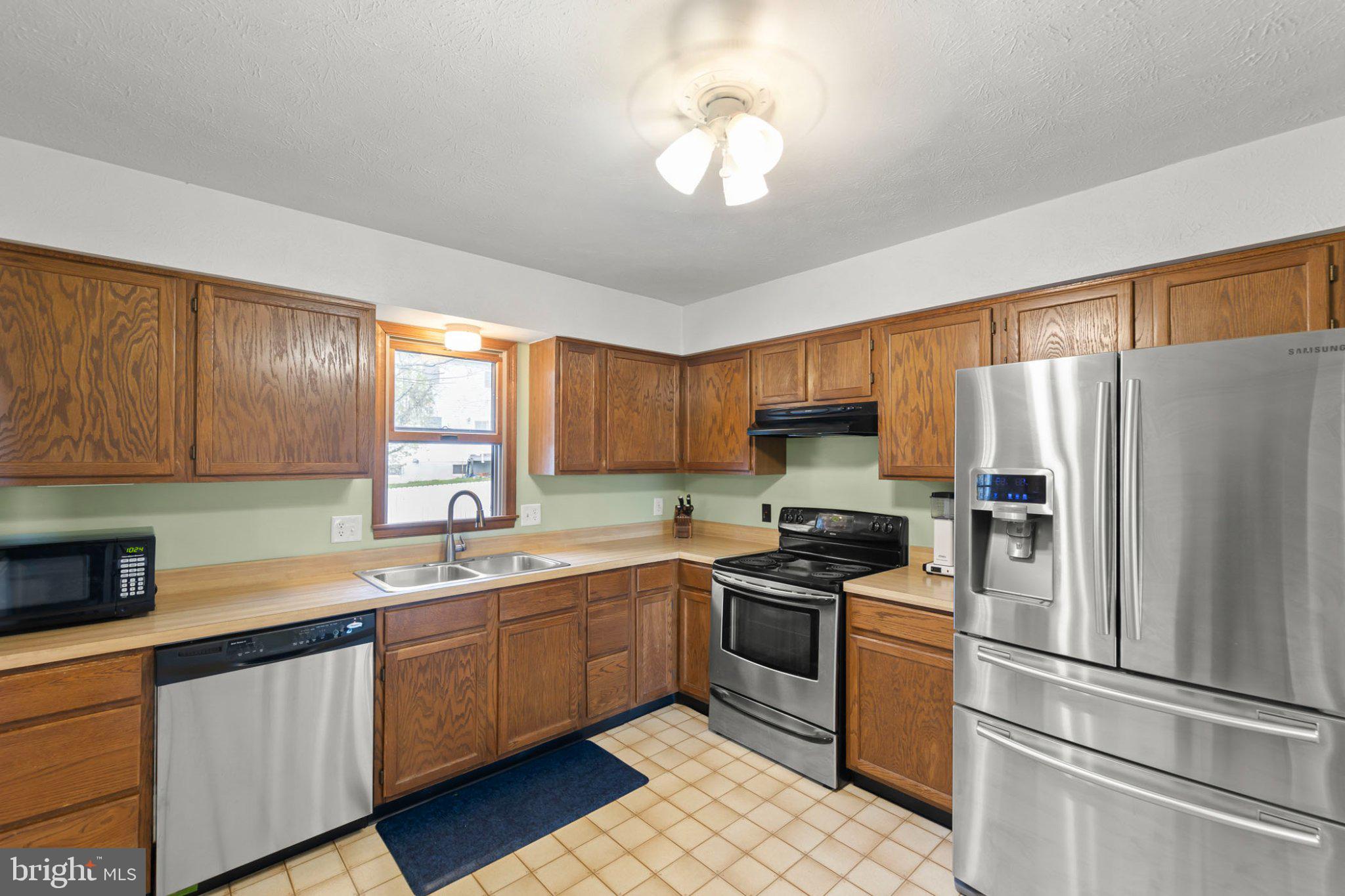 111 Asbury Road Winchester, VA 22602 - Photo 5 of 39 Modern kitchen with warm wood tones.