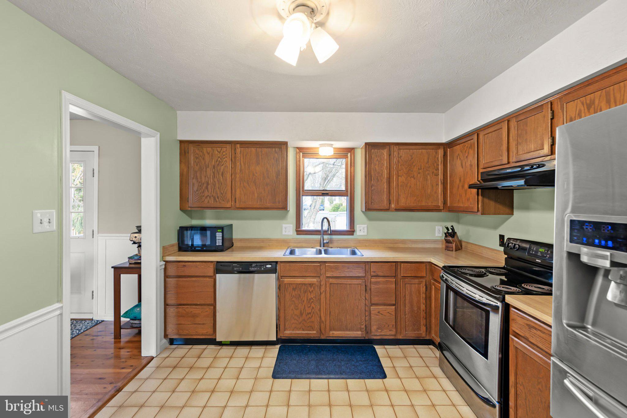 111 Asbury Road Winchester, VA 22602 - Photo 7 of 39 Charming kitchen with warm wood tones.