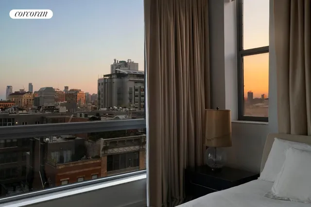 a view of a city from a hallway