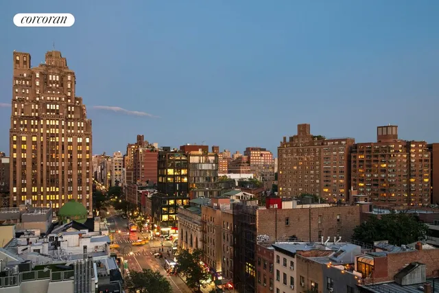 a view of a room with wooden floor and windows