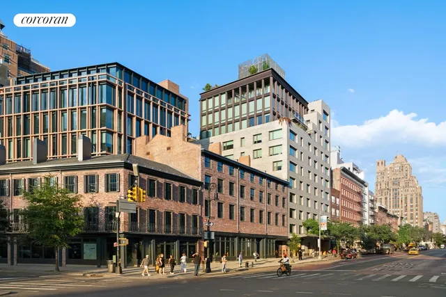 a city street lined with buildings and cars