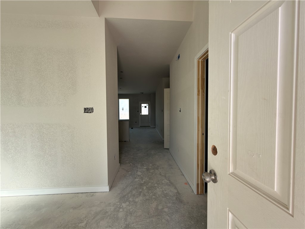 6049 Badger Street Bryan, TX 77807 - Photo 6 of 16 a view of a hallway with a room