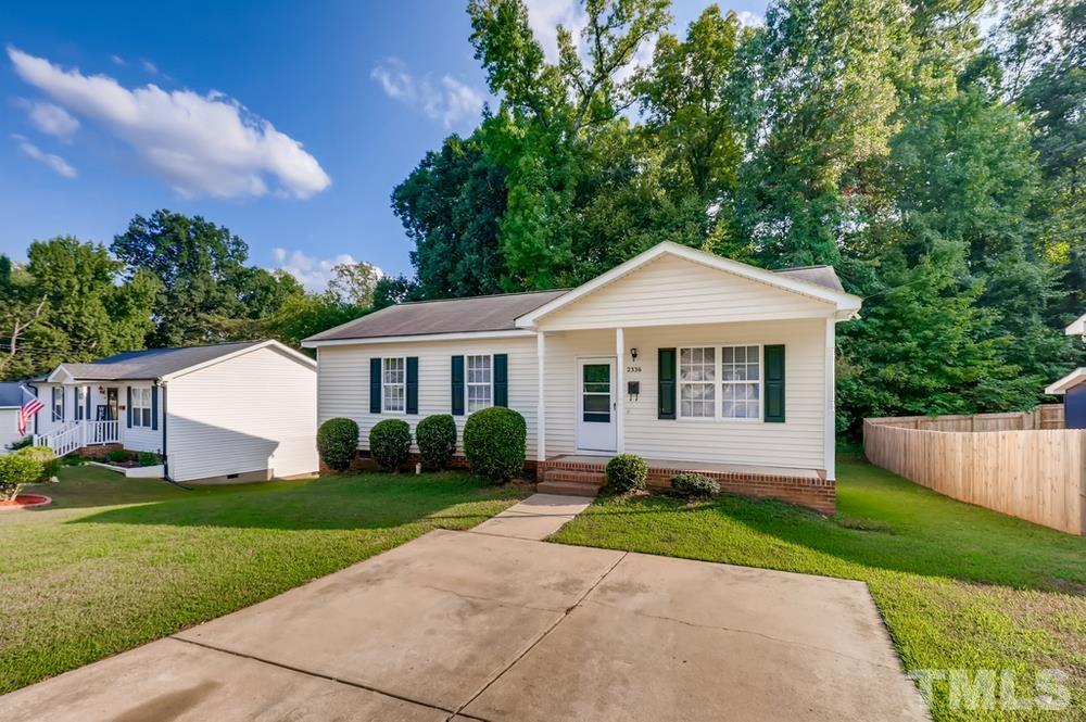 2336 Milburnie Road Raleigh, NC 27610 - Photo 1 of 28 a front view of a house with a yard