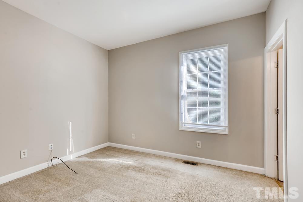 2336 Milburnie Road Raleigh, NC 27610 - Photo 13 of 28 an empty room with a window