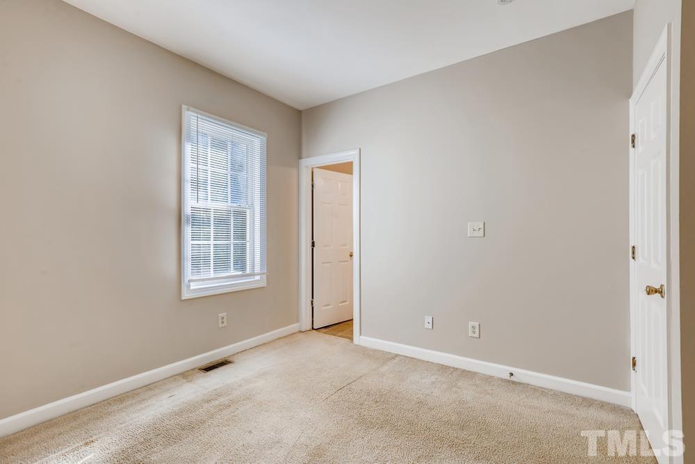 2336 Milburnie Road Raleigh, NC 27610 - Photo 14 of 28 an empty room with windows