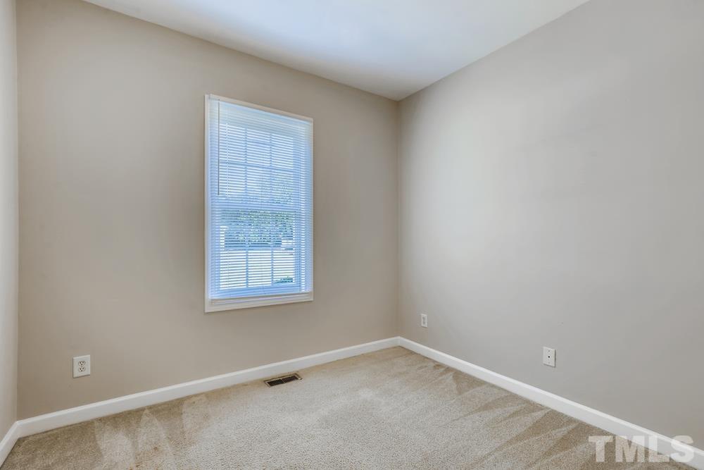 2336 Milburnie Road Raleigh, NC 27610 - Photo 17 of 28 an empty room with a window