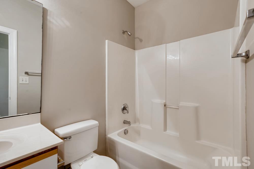 2336 Milburnie Road Raleigh, NC 27610 - Photo 19 of 28 a bathroom with a bathtub and toilet