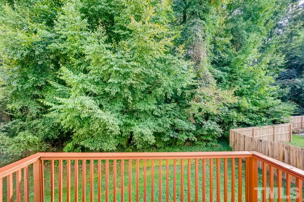 2336 Milburnie Road Raleigh, NC 27610 - Photo 23 of 28 a view of a balcony with a wooden fence