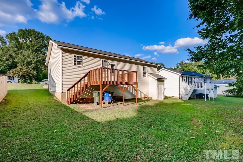 2336 Milburnie Road Raleigh, NC 27610 - Photo 25 of 28 a view of a house with backyard