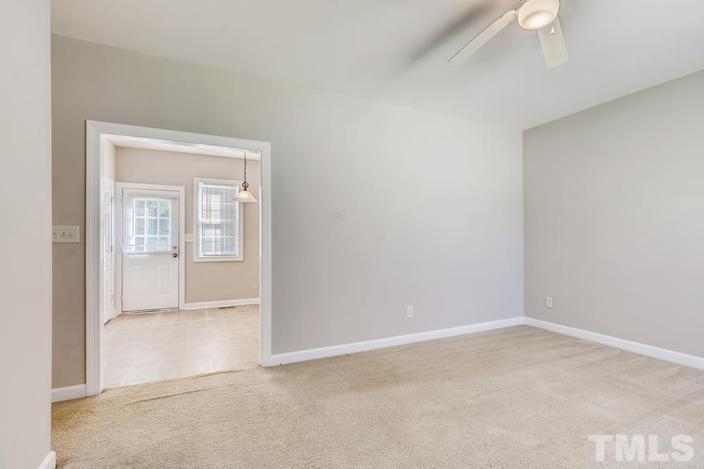 2336 Milburnie Road Raleigh, NC 27610 - Photo 4 of 28 an empty room with windows