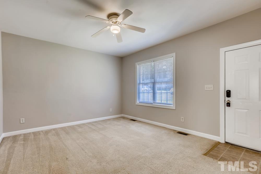 2336 Milburnie Road Raleigh, NC 27610 - Photo 7 of 28 a view of an empty room with a window