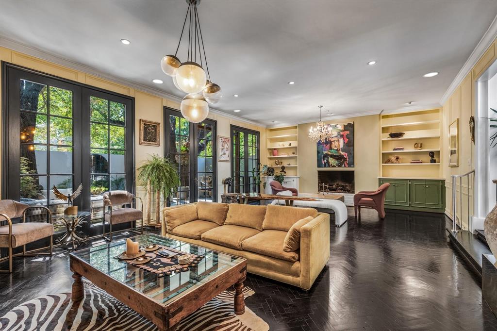 a living room with furniture a large window and a table