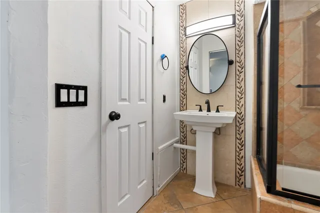a bathroom with a sink and a mirror