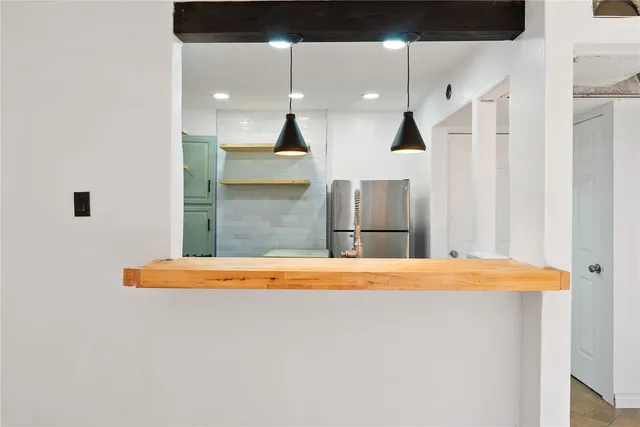 wooden floor with a bench in patio