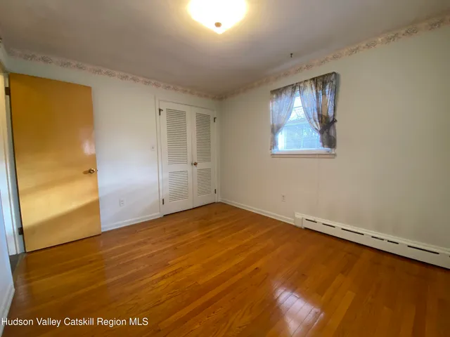 a view of a bathroom with a shower and a sink